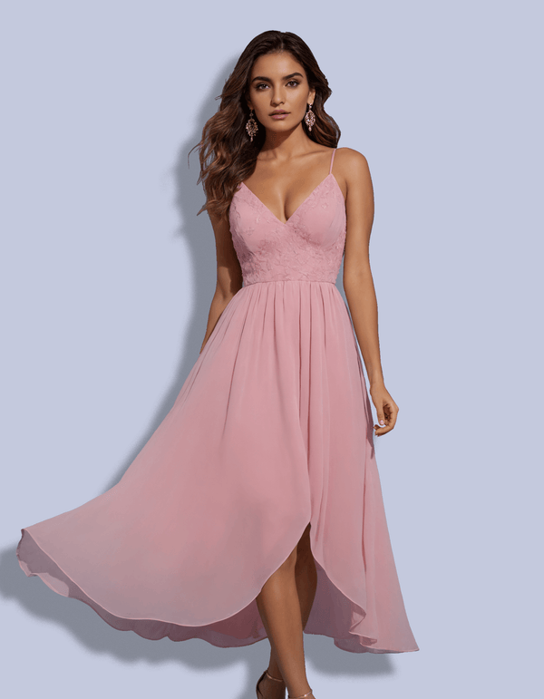 Woman wearing a pink dress against a light blue background