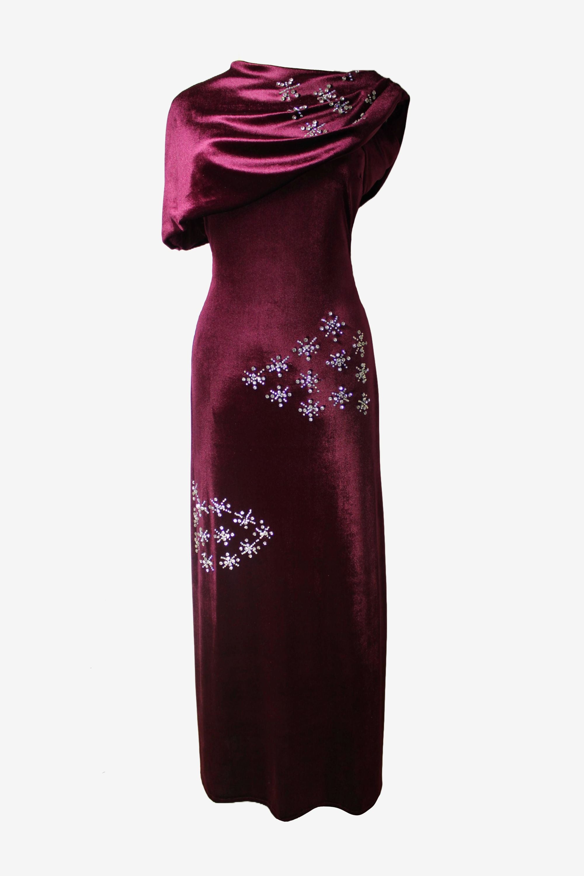 Magenta one-shoulder dress with floral embellishments on a white background