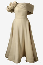 Beige evening gown with floral details on a white background