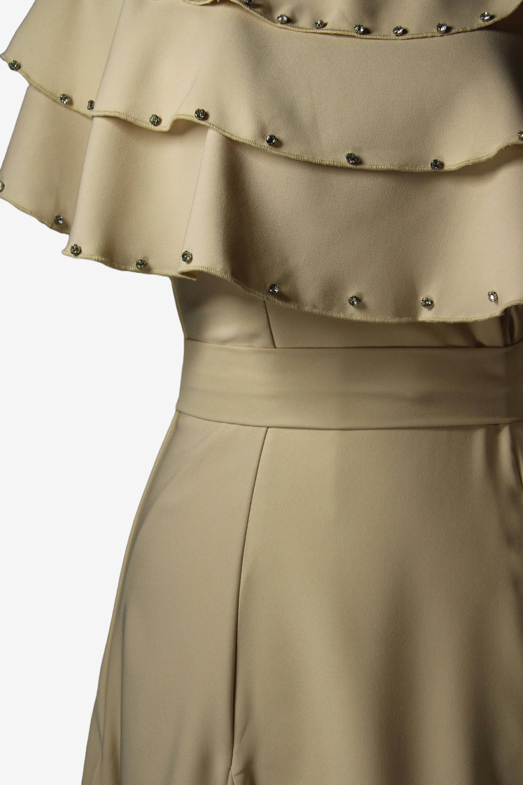 Beige dress with a layered ruffle top and studded details on a white background