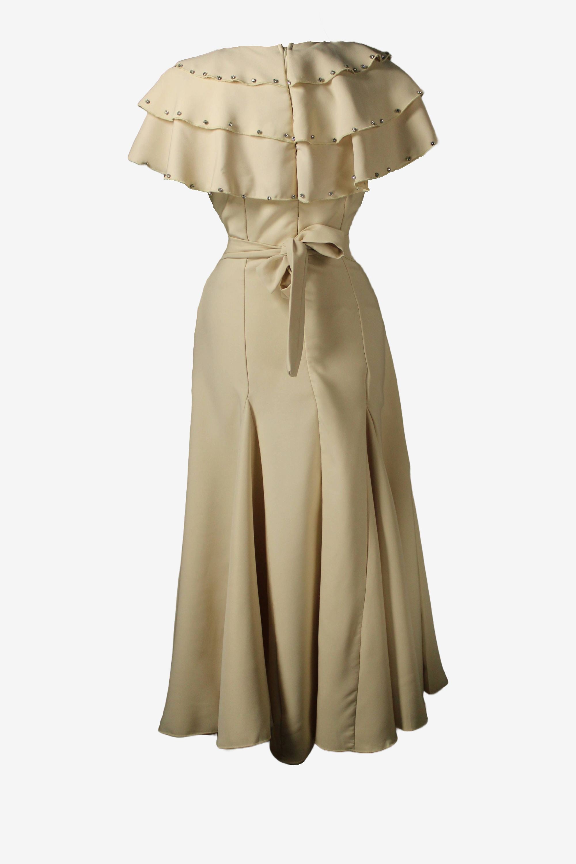 Beige off-shoulder dress with ruffled top on a white background