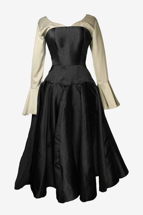 Black dress with beige long sleeves on a white background