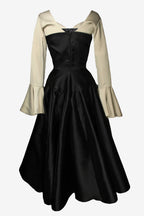 Black dress with beige sleeves on a white background