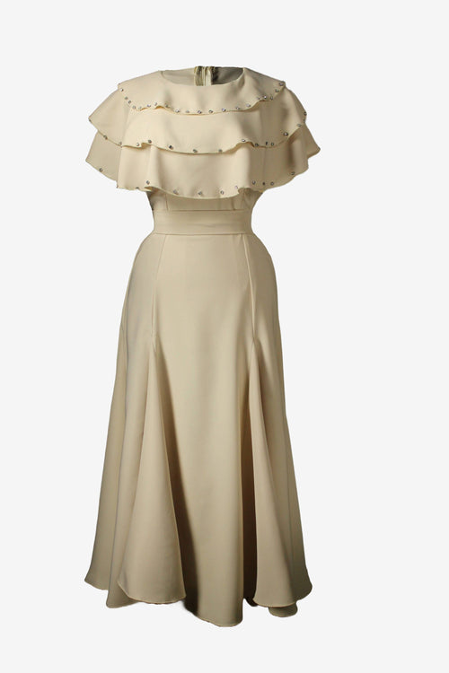 Beige dress with ruffled top on a white background