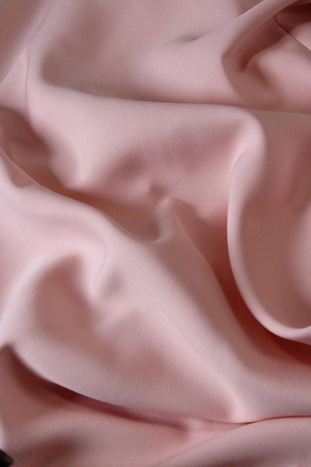 Close-up of pink fabric with folds