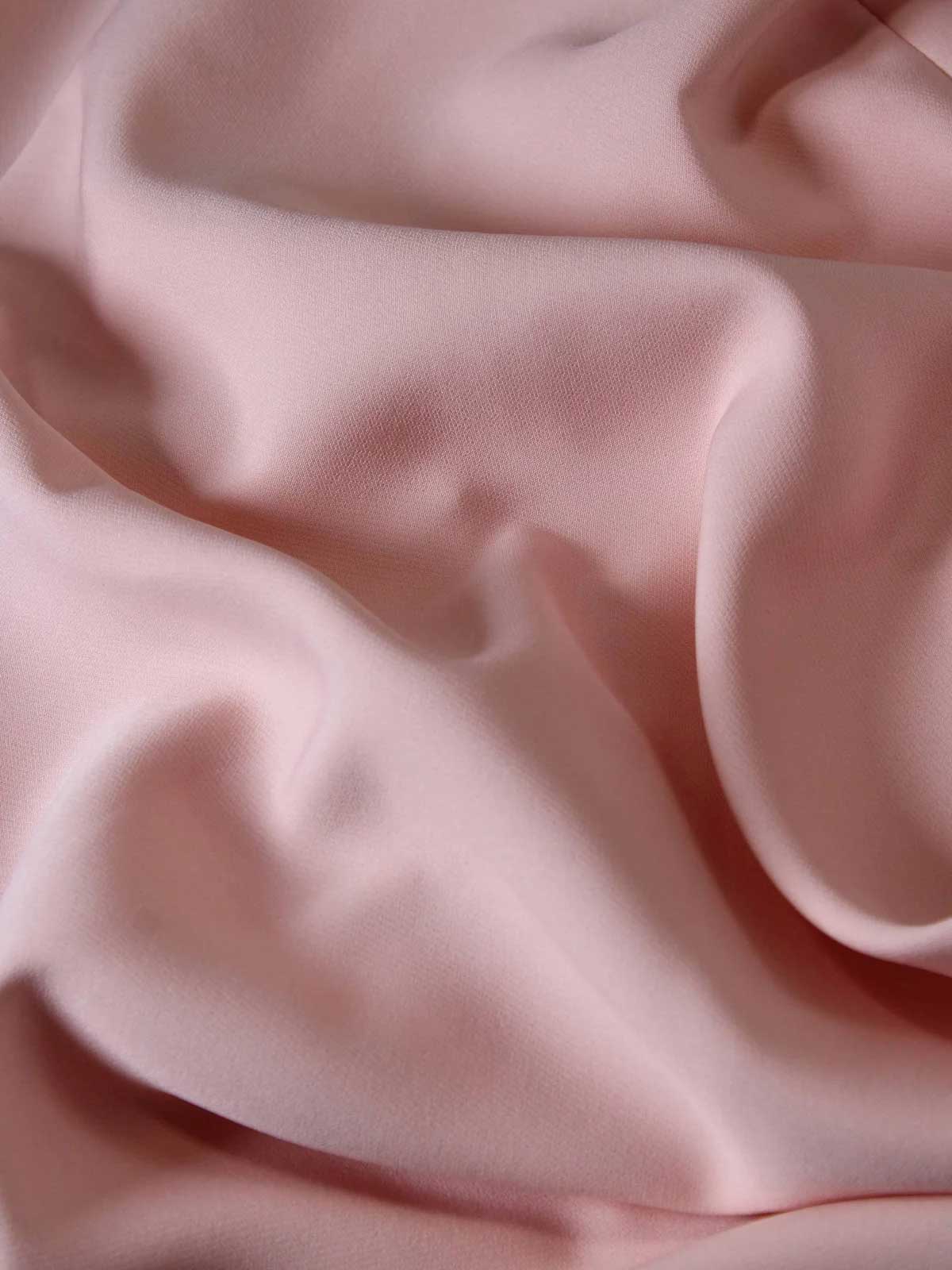 Close-up of pink fabric with folds