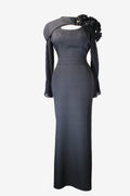 Black evening gown with floral details on a white background