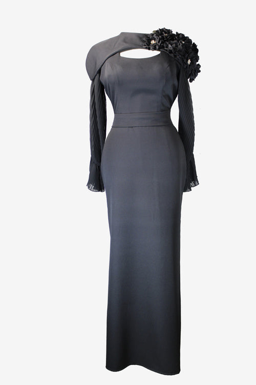 Black evening gown with floral details on a white background