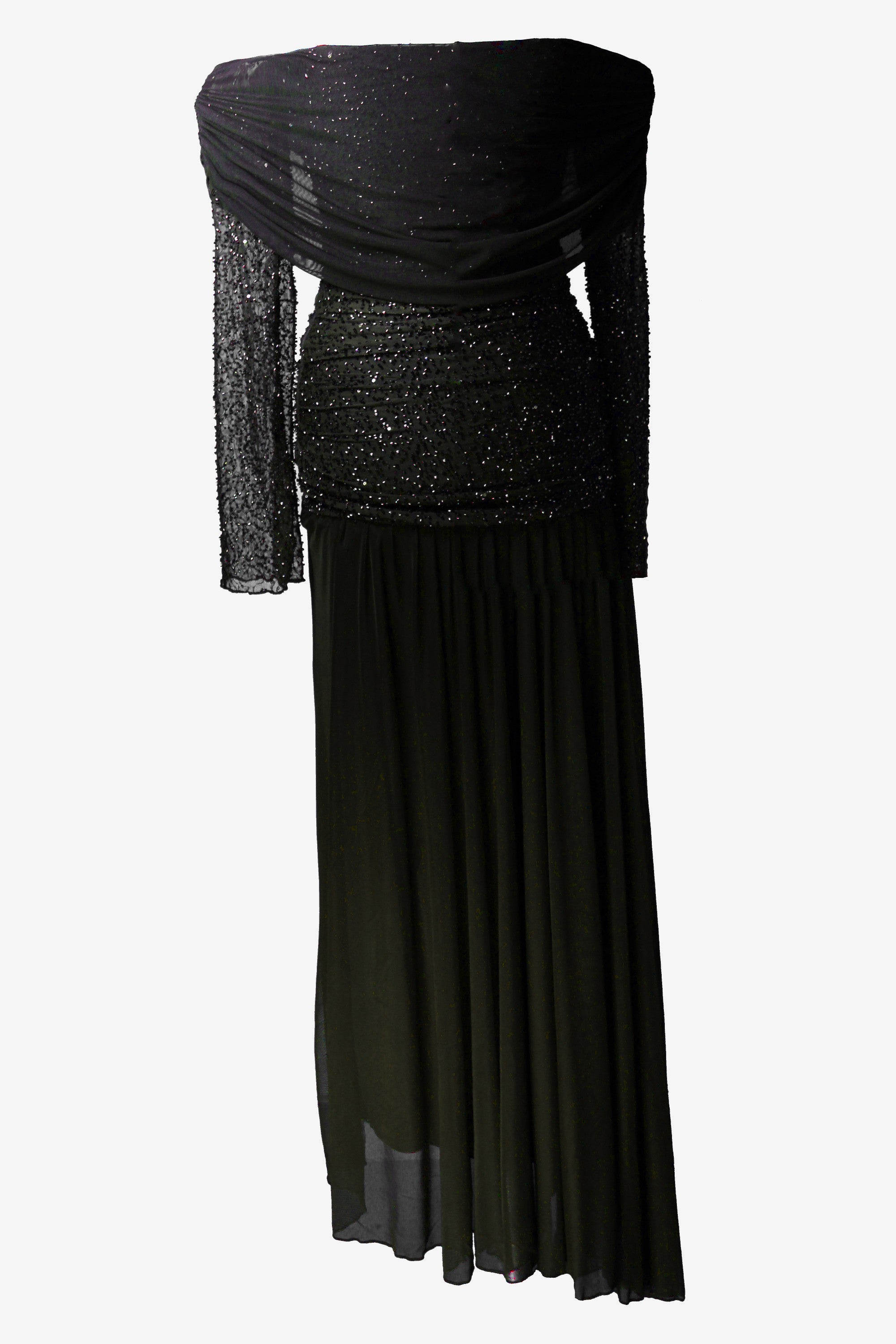 Black evening gown with sheer overlay on a white background