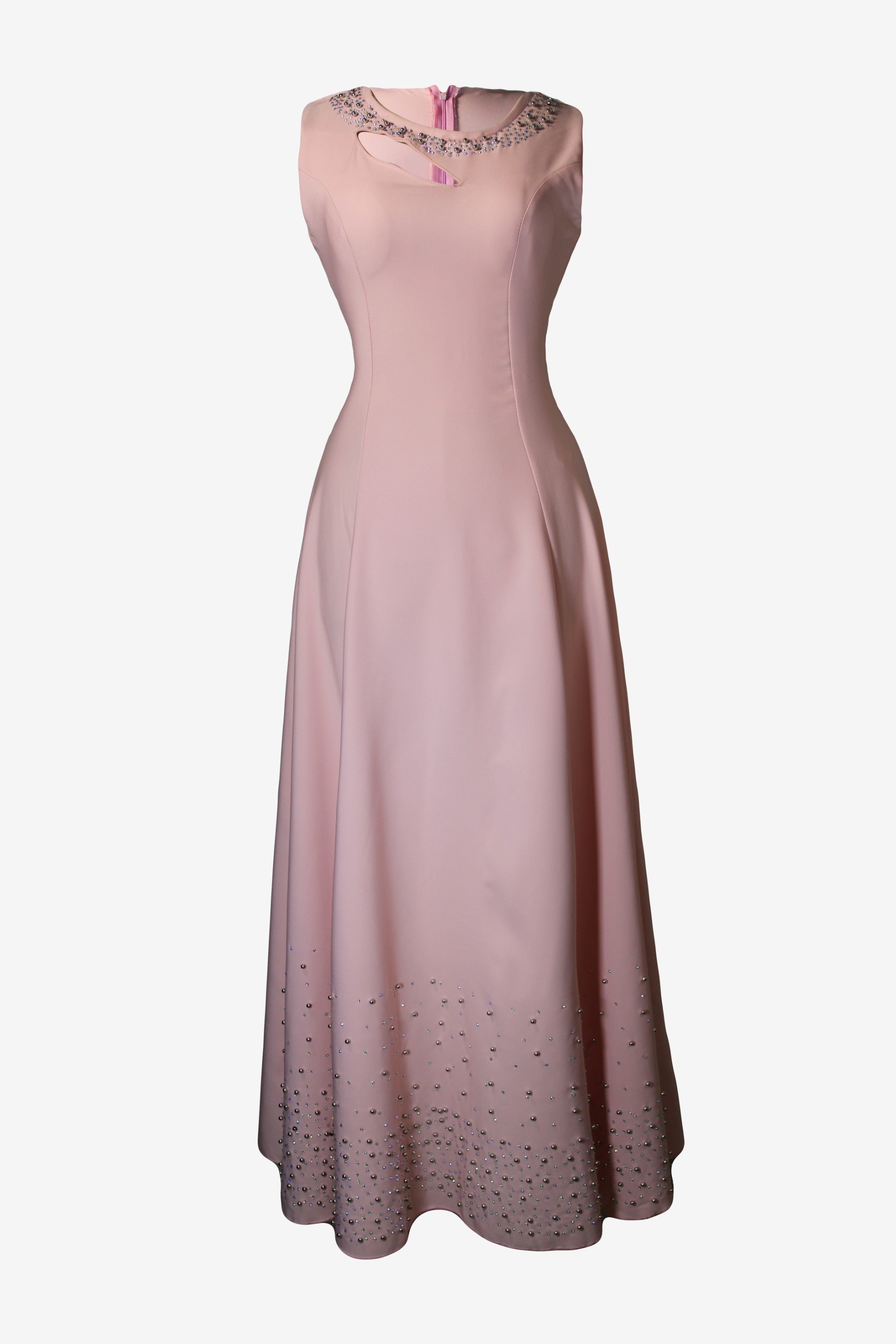 Pink dress with embellishments on a white background