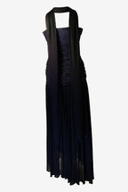 blue dress with sheer overlay on a white background