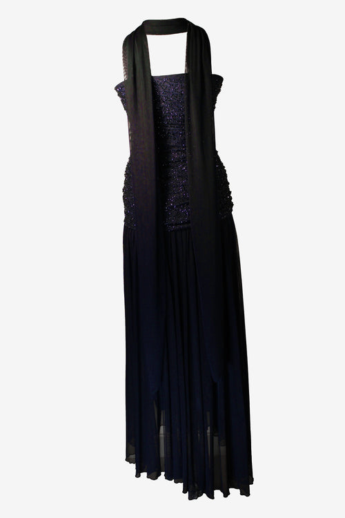 blue dress with sheer overlay on a white background