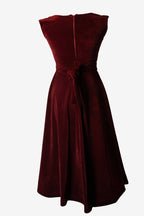 Red strapless dress with a belt on a white background