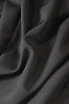 Close-up of black fabric with folds