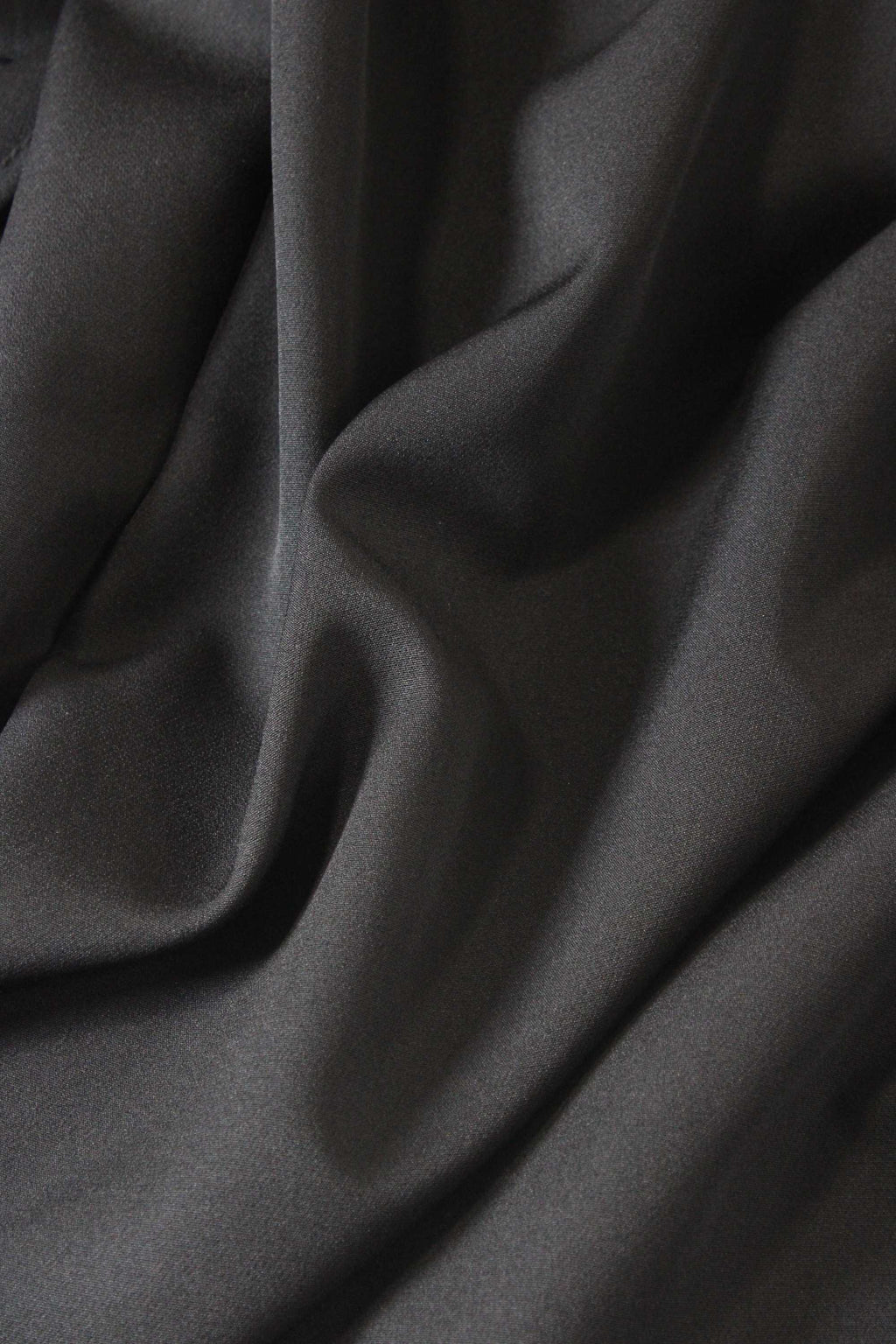 Close-up of black fabric with folds