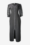 Black dress with silver embellishments on a white background