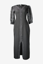 Black dress with silver embellishments on a white background