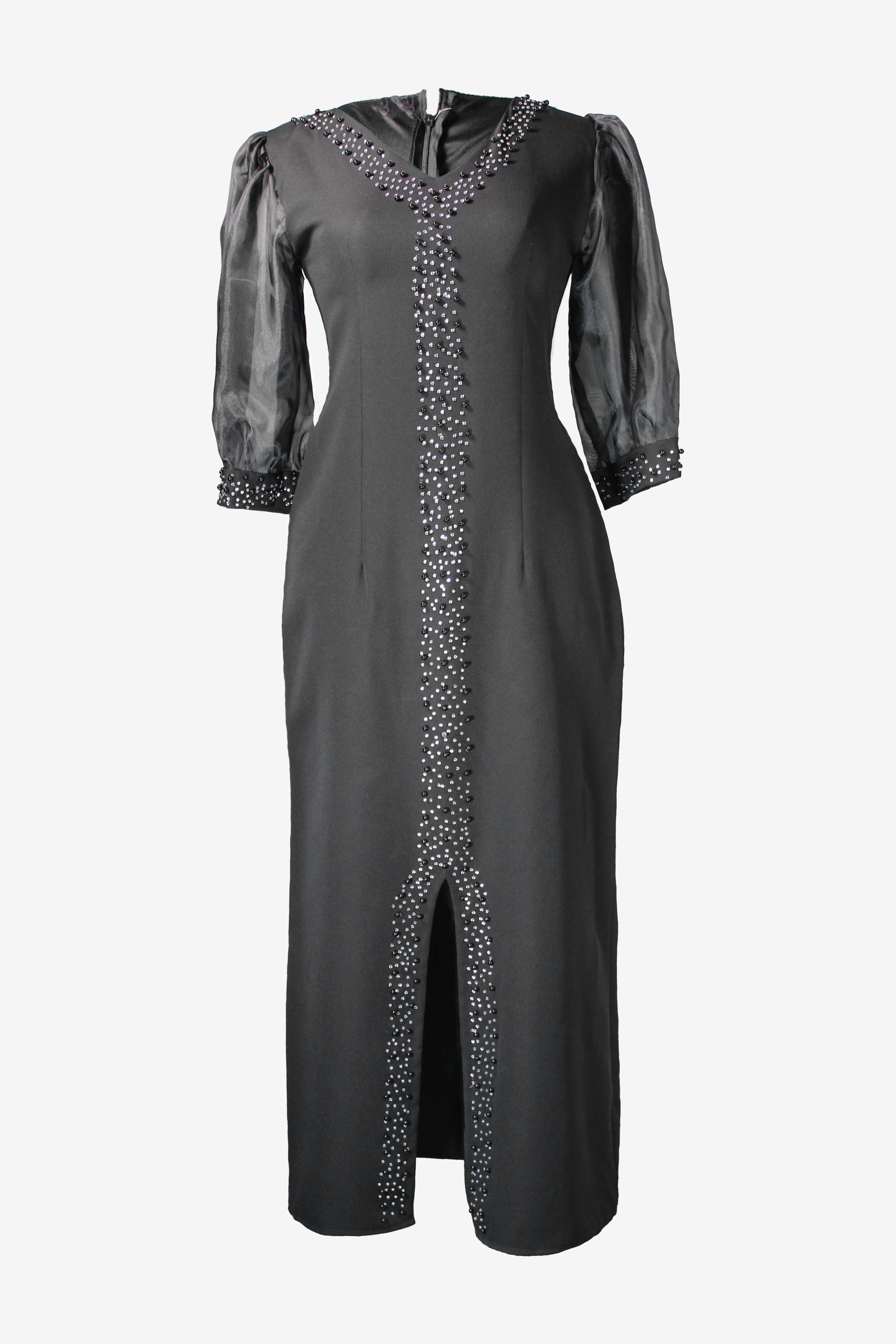 Black dress with silver embellishments on a white background