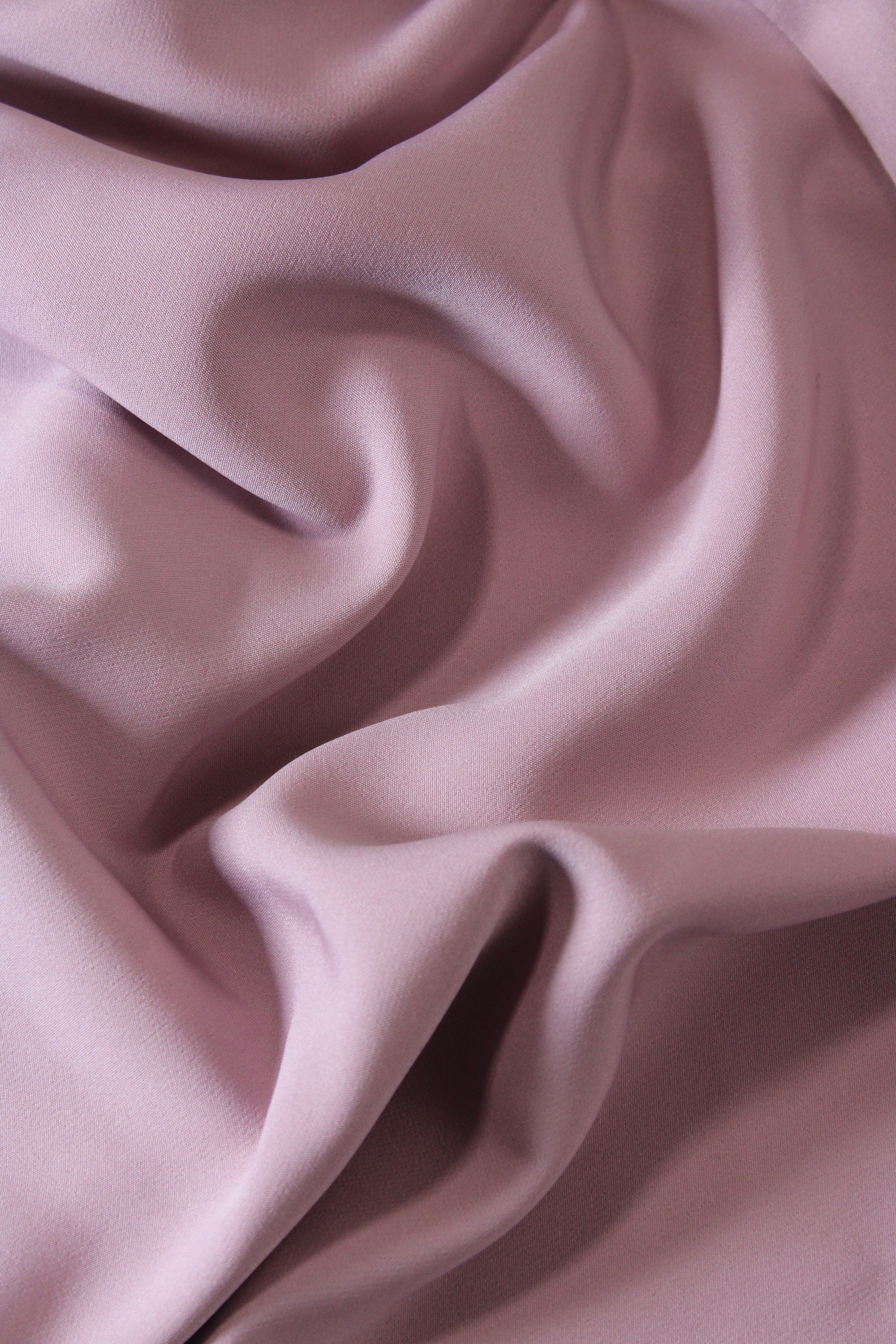 Close-up of pink fabric with folds