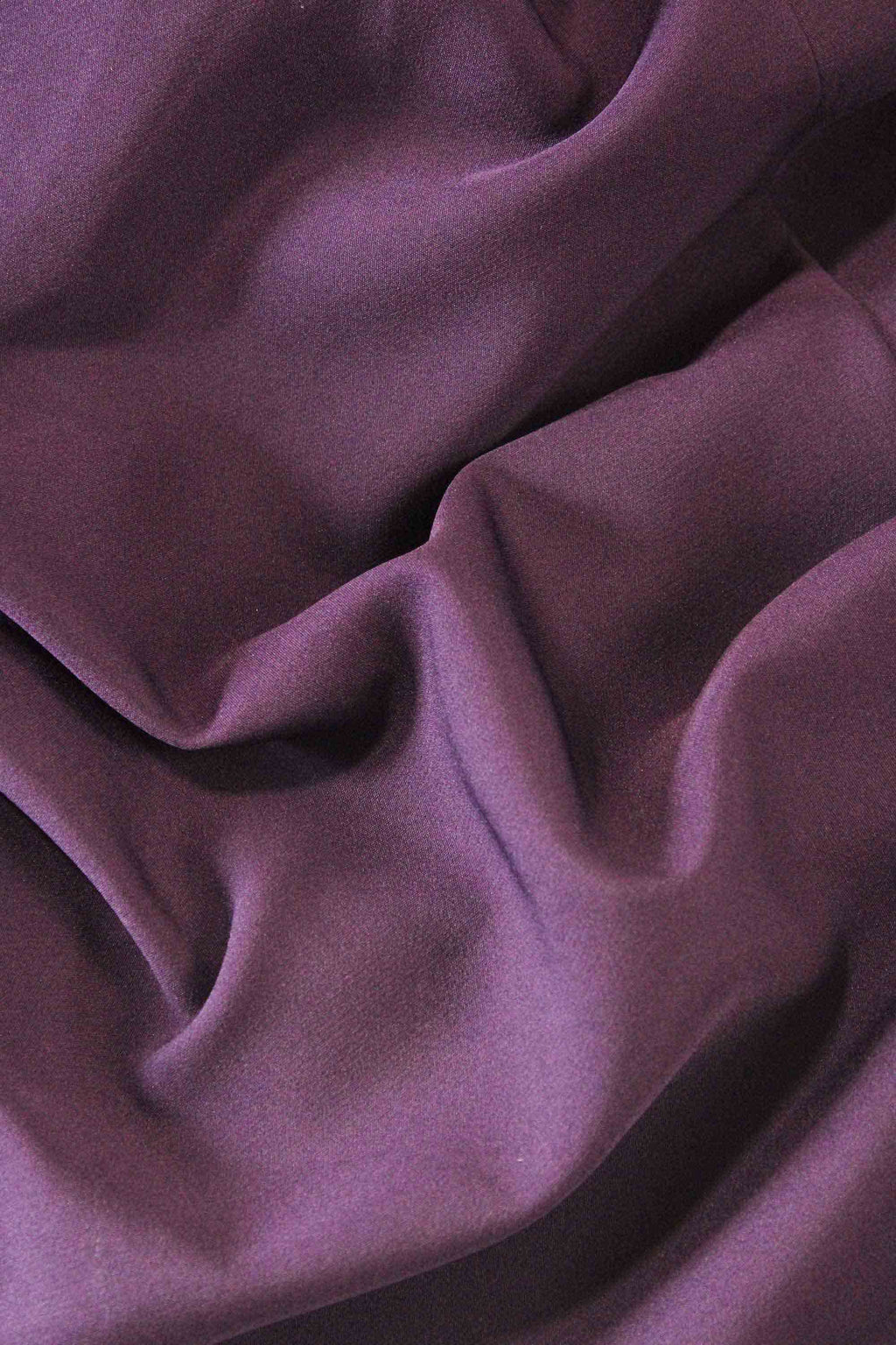 Close-up of purple fabric with folds
