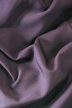 Close-up of purple fabric with folds