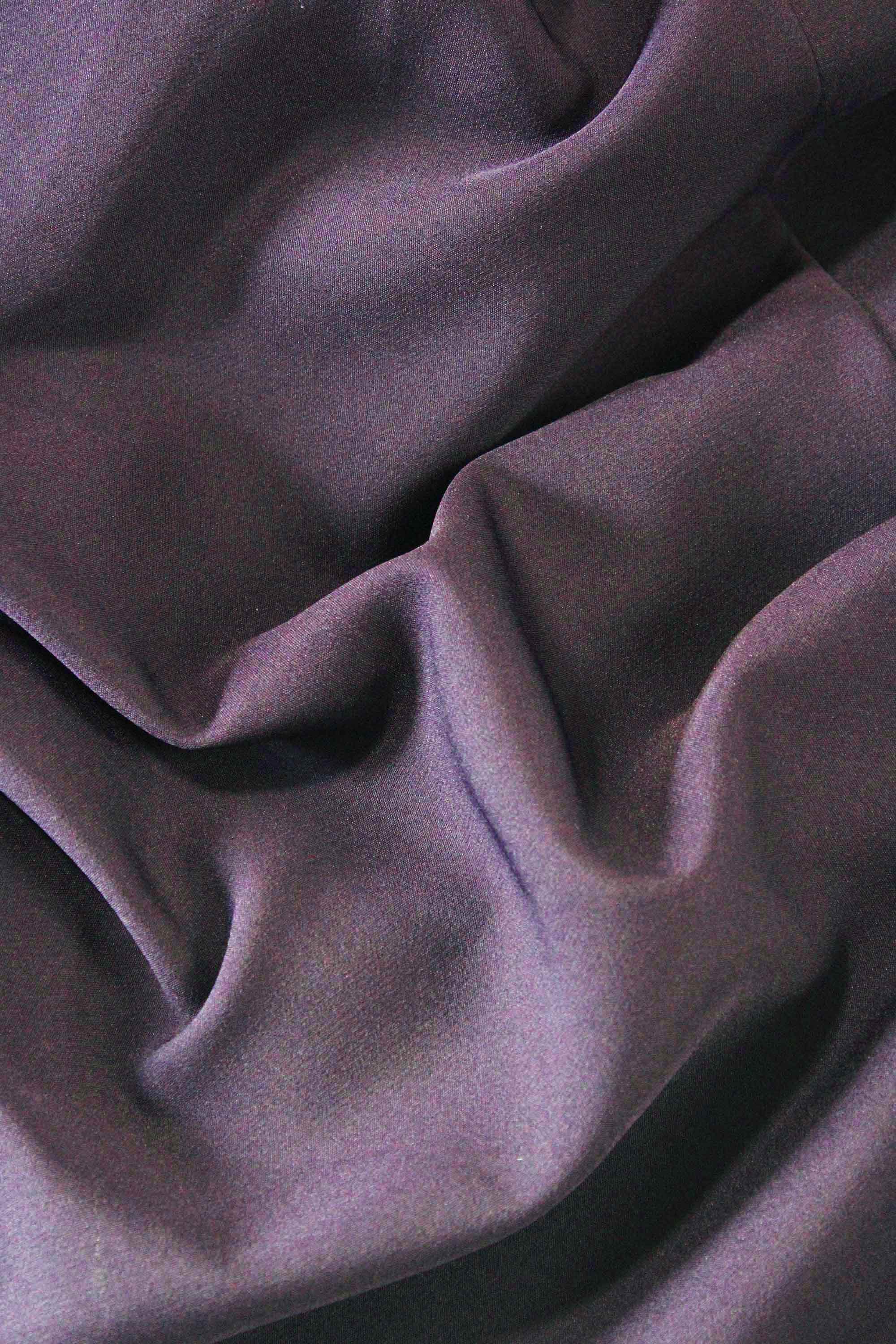 Close-up of purple fabric with folds