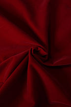 Close-up of dark red fabric with folds