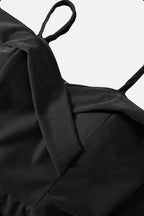 black dress with off-shoulder on a white background