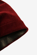 Close-up of a red fabric texture with a white background