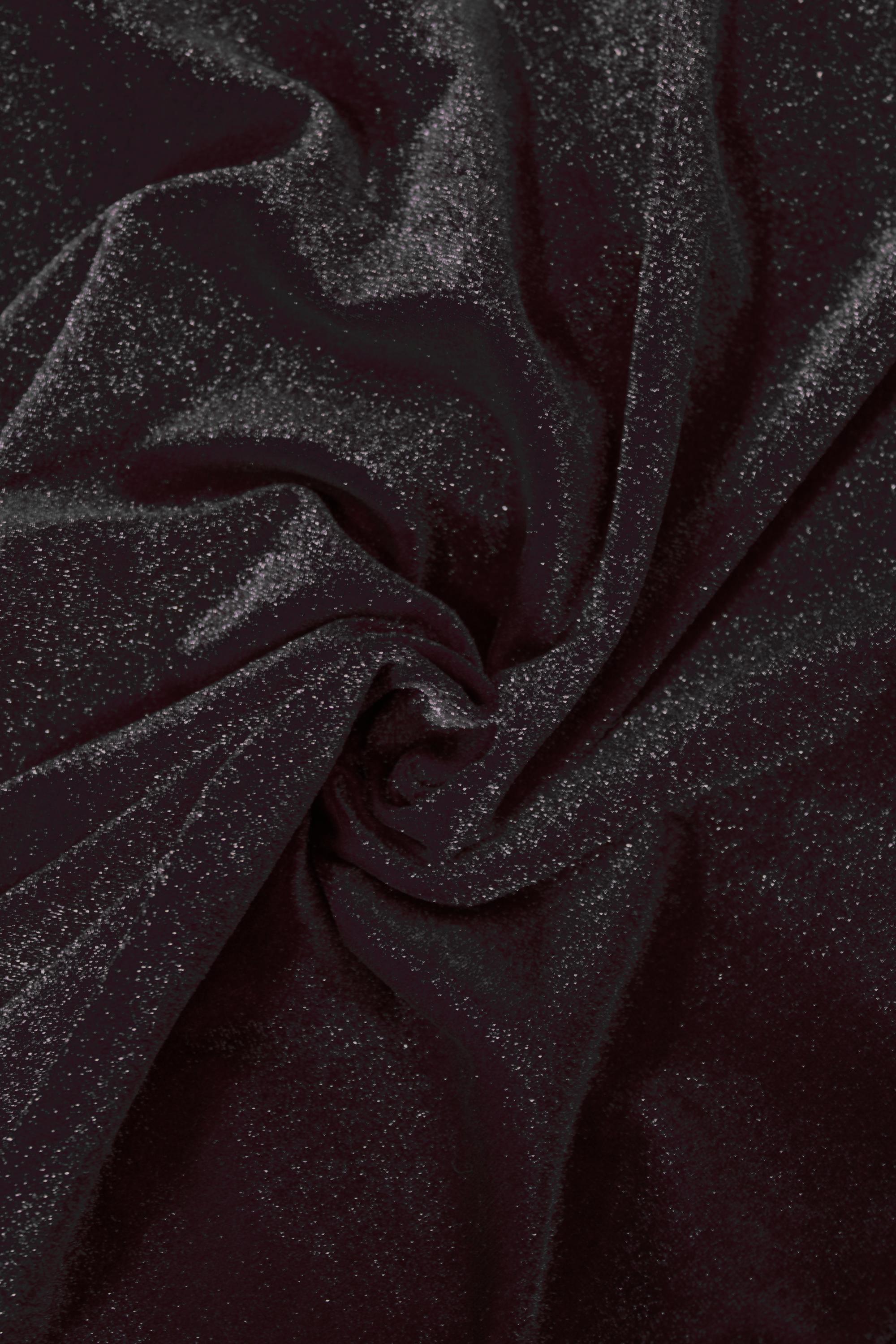 Close-up of dark brown fabric with a textured surface