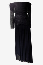 Black evening gown with sheer sleeves on a white background