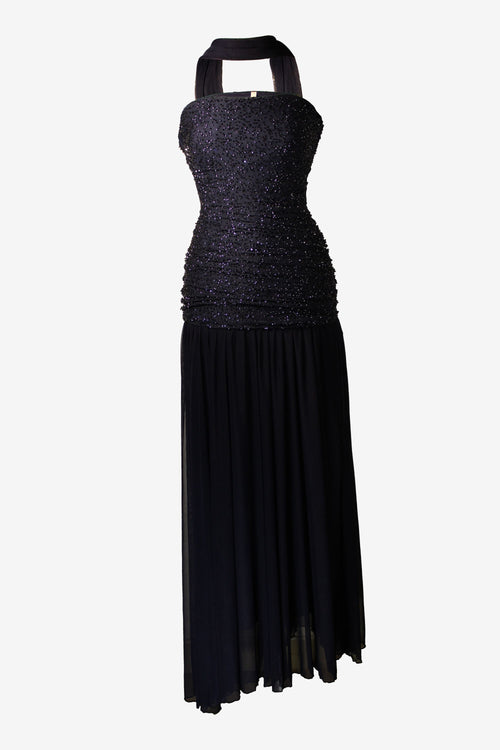 blue evening gown with a halter neckline on a white background