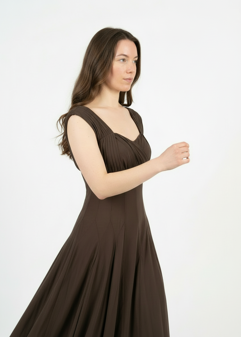 Woman wearing a brown dress on a white background