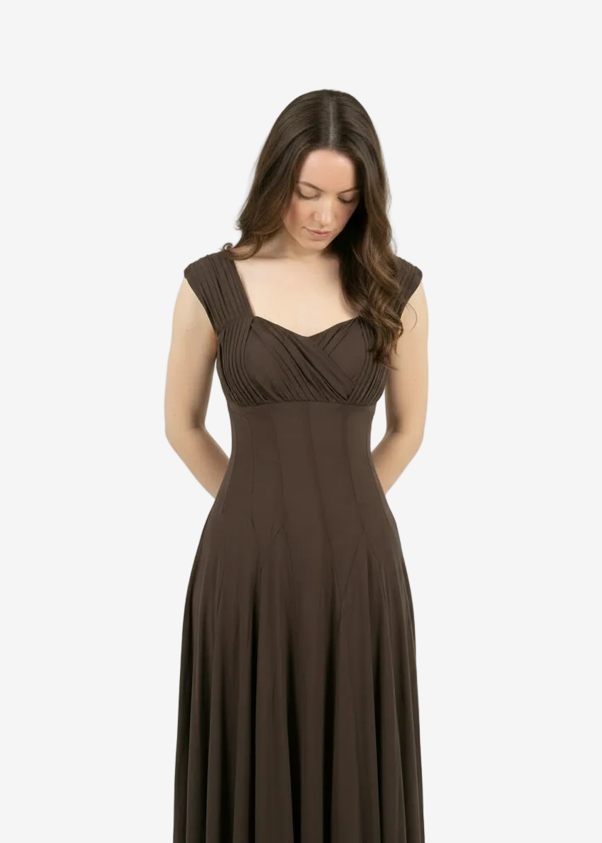 Woman wearing a brown evening gown on a white background