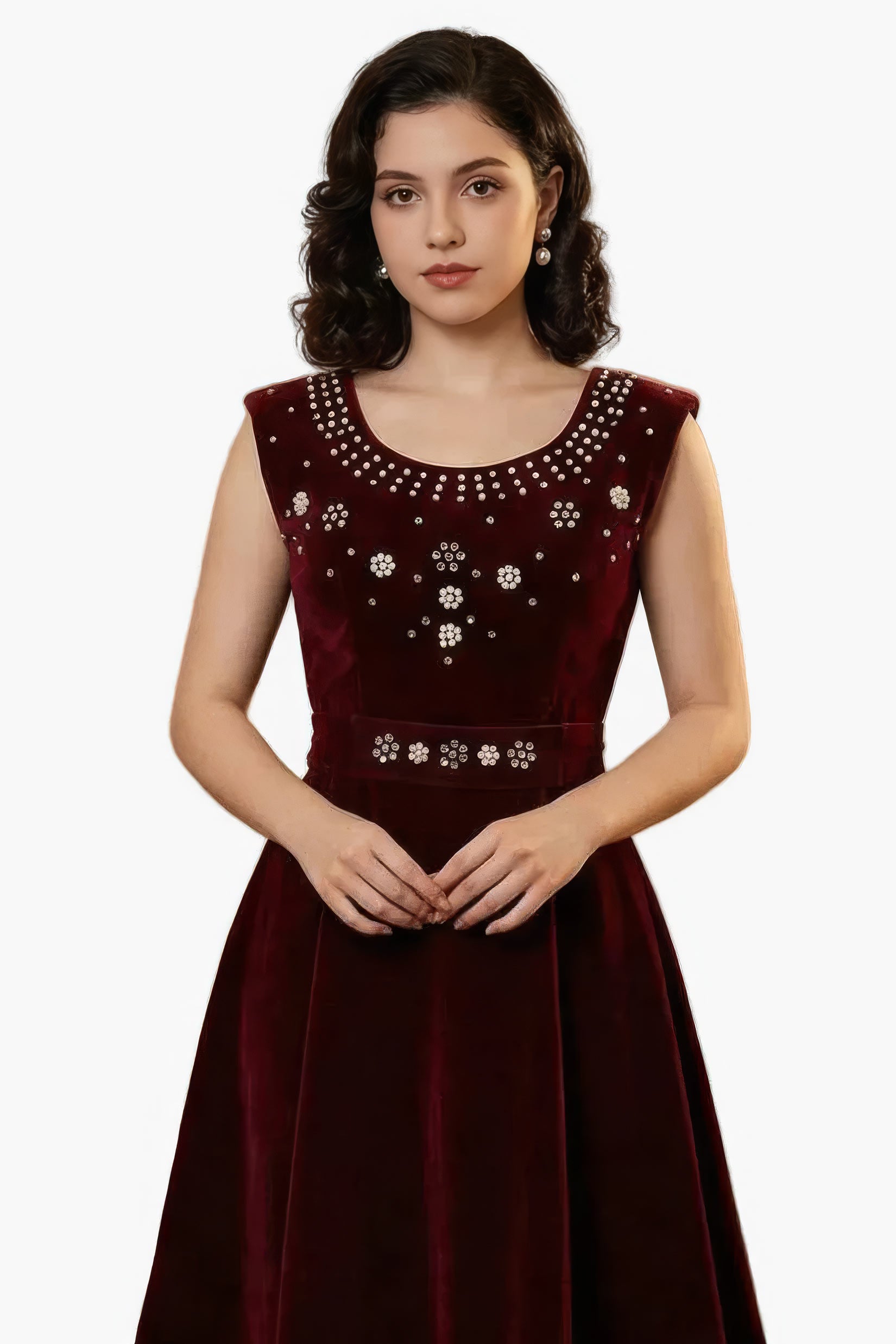 Woman wearing a maroon dress with floral embellishments on a white background