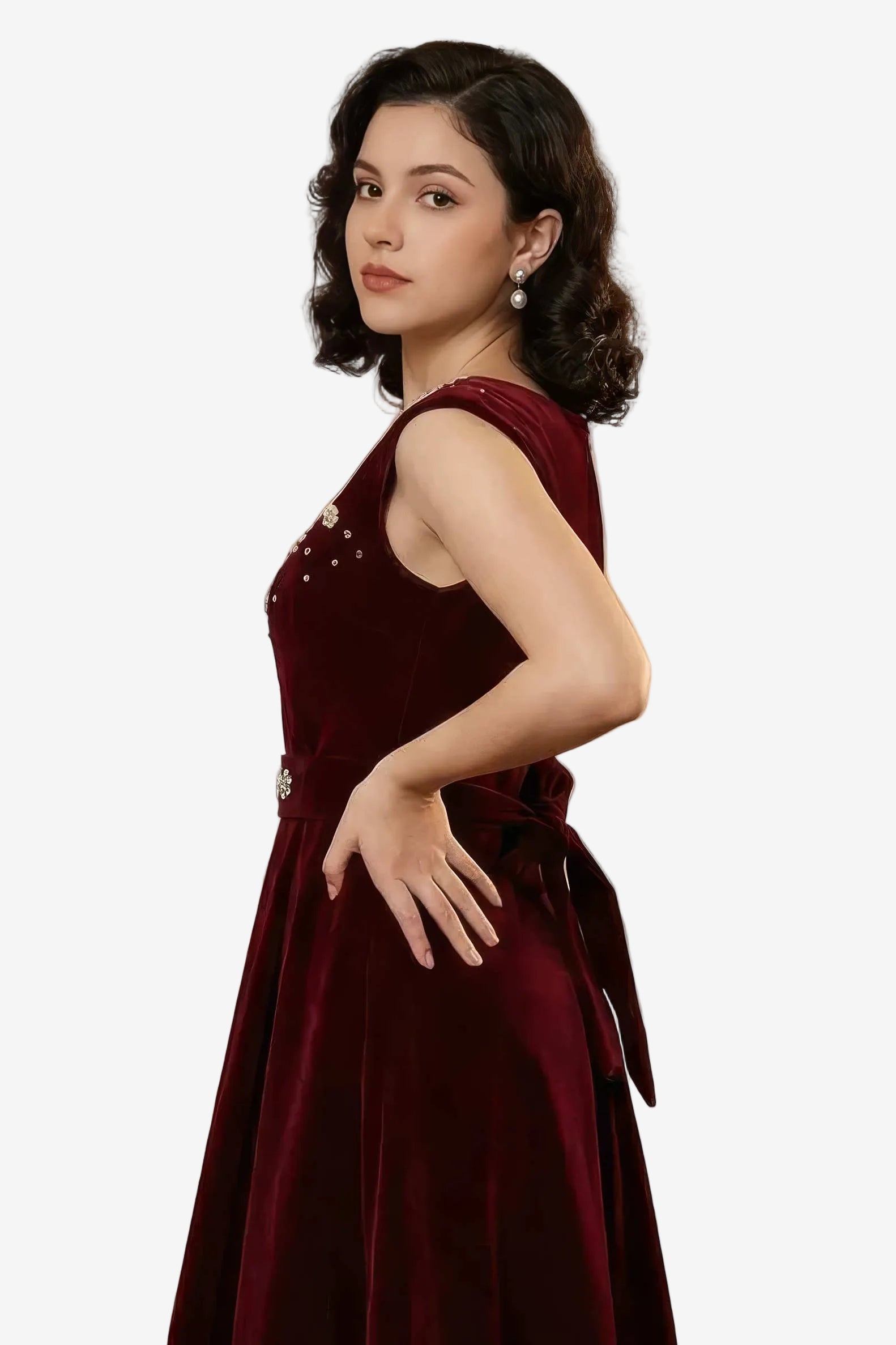 Woman wearing a burgundy dress with a white background
