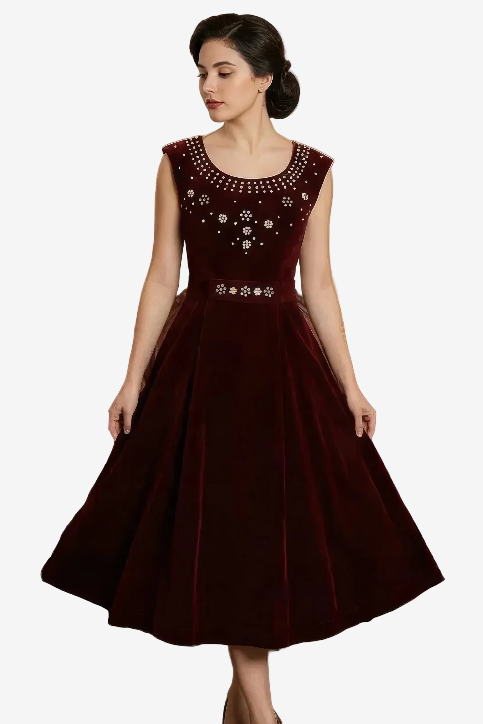 Woman wearing a burgundy dress with floral embellishments on a white background