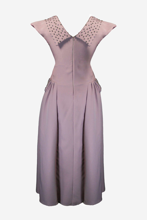Purple dress with decorative neckline on a light purple background