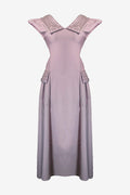 Mauve dress with embellished neckline on a white background