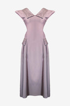 Mauve dress with embellished neckline on a white background