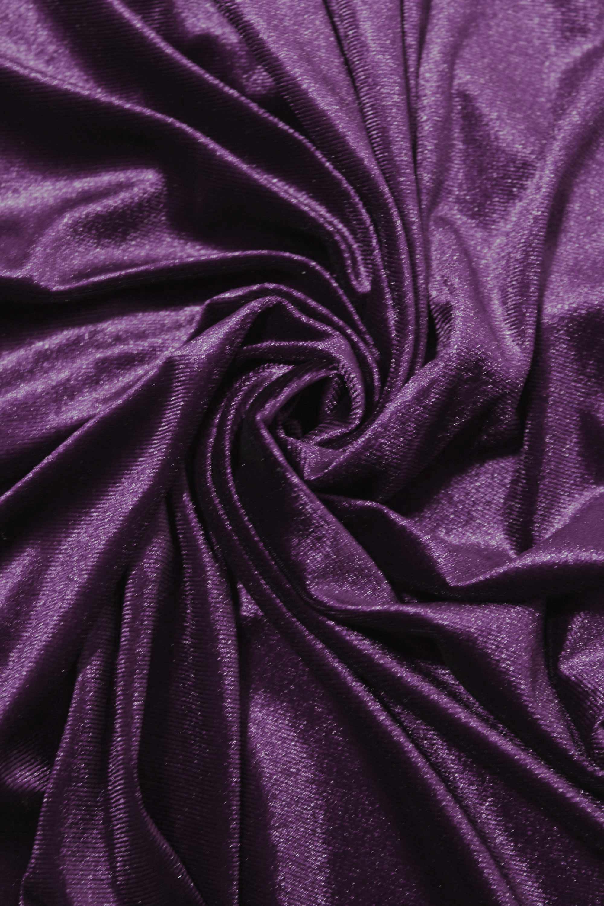 Close-up of purple fabric with a swirl pattern